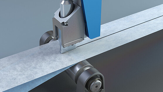 A microbond system cutting a nonwoven fabric 